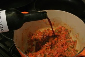 Cook until wine is almost evaporated.