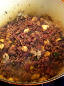 Brown the ground elk with the mushrooms, green onions, and garlic.