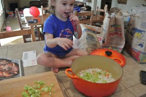 Mady's job is to put all the vegetables in the pot while eating and not getting her "Go Gurt" in the pot.