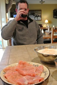 The Heckler drinking wine, watching me slave in the kitchen.