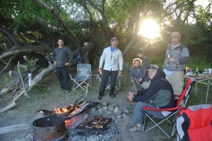 There is a nice fire going, and they set up chairs around it so we could watch Claudio work.